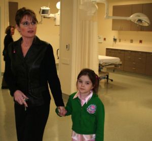 Sarah Palin with the girl she was assigned to work with in her new geography class. "I wish they had assigned me someone mature and who at least knew the capital of Mexico," said the small girl.