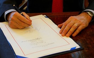 Bush signing the bailout bill with BIG LETTERS so as it's clear he did sign it.